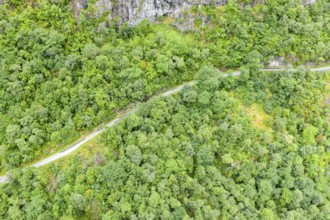 Aerial view of road above lake Lovatnet (or: Loenvatnet), valley Lodalen south of village Loen,