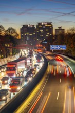 Evening traffic, partly with traffic jams, slow-moving traffic on the A40 motorway, Essen skyline,