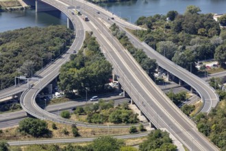 Winding motorway bridges cross a river in an urban area, Vienna