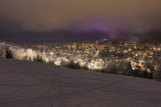 Town view at snow and night, Eibenstock in the Ore Mountains, Saxony, Germany, Europe