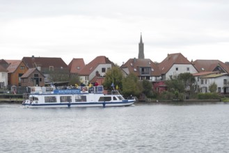 A passenger ship of the Blau Weiße Flotte shipping company is travelling on Lake Malchow, Malchow,