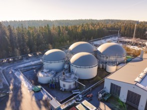 Large round tank structures in an industrial complex near a forest, Neubulach, Black Forest,