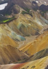 Small river between colourful rhyolite mountains, volcanic landscape, erosion landscape, view from