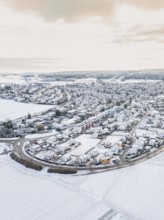 Snow-covered fields and village view in winter with roads, Calw- Stammheim, Black Forest, Germany,