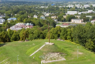 Large wooden cross on a green hill above the urban landscape, Wysoka Górka, Wysoka Gorka, Chelmska