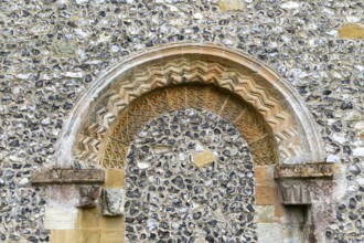 Chevron pattern of flint pebble blocked Norman doorway, church of Saint Mary, Kingsclere,