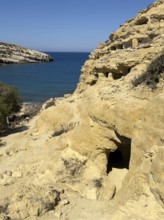 View of entrances of caves in sandstone rocks of former Roman necropolis with sandstone caves