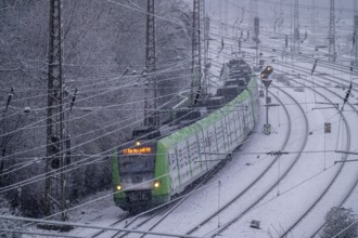 Winter weather, heavy snowfall, railway tracks in front of Essen main station, S-Bahn train, North