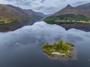 Mountains reflected in fjord, coast, island, autumn, cloudy, sailboat, aerial view, Loch Leven,