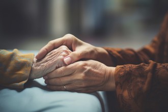 Close up of hands of middle aged woman holding elderly woman's hands. KI generiert, generiert AI