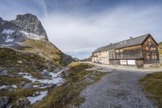 Lamsenjochhütte in autumn, rocky summit of the Lamsenspitze behind, Karwendel, Tyrol, Austria,