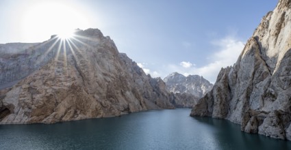 Mountain lake Kol Suu rocky steep mountains, sun star, Kol Suu Lake, Kurumduk Valley, Sary Beles