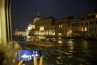 Night shot with smartphone from the vaporetto on the Grand Canal, Venice, metropolitan city of