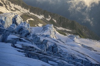 Glacier ice with crevasses in the evening light, Glacier du Tour at sunset, High alpine mountain