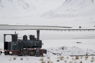 Historic mine railway in winter landscape, Kongsfjord, Ny-Ålesund, Spitsbergen Island, Svalbard and