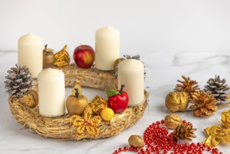 Making an Advent wreath, white candles, Christmas decorations, white background