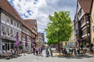 Bäckerstrasse with typical town houses and street cafés in the old town, Hameln, Oberweser, Weser,