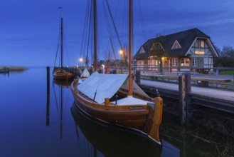 Fischland Brauerei, brewery and traditional sailing boats at dusk in the harbour of Althagen,