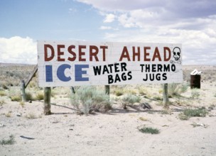 Sign warning of the desert, advert for ice, water bags, thermos flasks, USA 1963