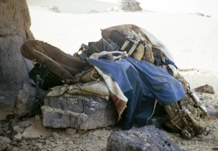 Taureg camel saddle, trappings, equipment, Sahara desert, near Djanet, Algeria, North Africa 1973,