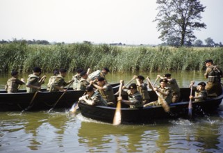 Students taking part in military exercises as army cadets, South of England, United Kingdom, late