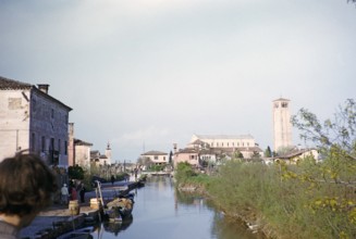 View through the canal to the church of St Fusca of Ravenna, Torcello island, Venice lagoon,