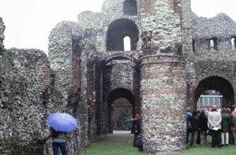 Group tour of the ruins of St Botolph's Priory, Colchester, Essex, England, UK 1979