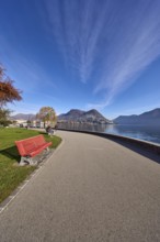 Belvedere garden, lakeside promenade, lake, lawn, trees, bench, hill, blue sky with cirrostratus