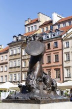 Market square with mermaid Syrenka and historic buildings in the old town centre of Warsaw, Poland,