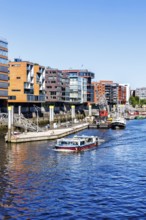 Building in the HafenCity Sandtorhafen harbour with boats in Hamburg, Germany, Europe