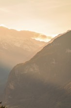 Sunrise over misty valleys and mountains, creates a peaceful atmosphere, Switzerland, Europe