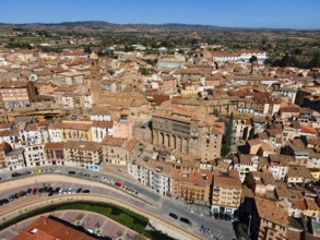 Aerial view of a historic city with many narrow streets and tiled roofs, aerial view, church,