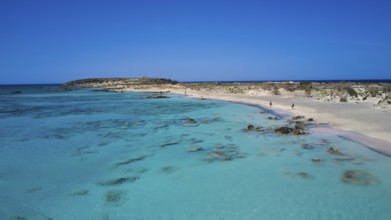 Artistic to natural blue water shores with sandy beaches and an island in the background. A calm,