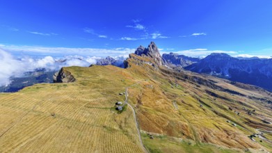 The Sas Rigais and Furchetta peaks of the Odle Group, drone shot, Val Gardena, Dolomites,