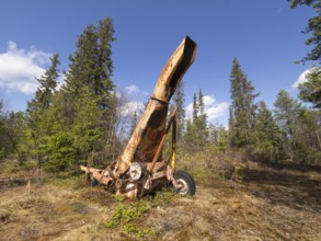 Derelict silage harvester, abandoned in a forestry area, May, Finnish Lapland