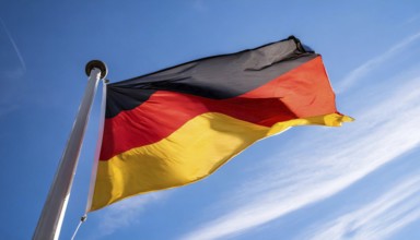 Flag, the national flag of Germany fluttering in the wind