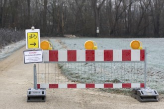 Barrier due to flooding and danger of falling rocks, barrier, landslide, traffic signs, attention