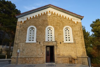 Historic church with striking stone façade and symmetrical windows, Koroni, Byzantine fortress,