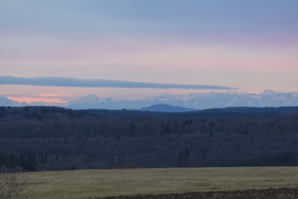 Alpine view near Magolsheim. The Bussen mountain in the distance. Sunset with alpine panorama