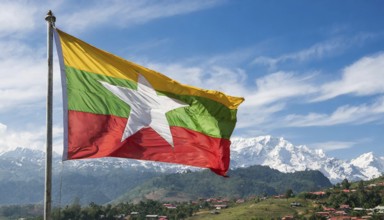 Flags, the national flag of Myanmar flutters in the wind