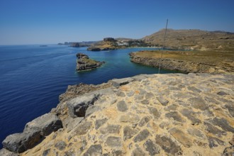 Extensive view of the blue sea and the rocky coast on a clear day, tomb of Cleovoulos the Lindier,