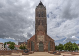 Remaining tower of St Mary's Church, built from 1260-70, in front the bases of the pillars of the