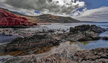 Lava rocks at the Playa de los Ciclos near the Green Lake, Lago Verde, El Golfo, Lanzarote, Canary