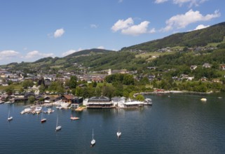 Drone shot, lake promenade with boats at Mondsee, Mondsee, Salzkammergut, Upper Austria, Austria,