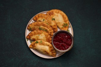 Fried mini pasties, with red sauce, top view, close-up, no people, selective focus