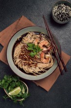 Soba, buckwheat noodles, with shimeji mushrooms and tiger shrimps, sesame, lime, parsley, homemade,