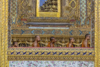 Wat Phra Kaeo temple, royal palace. Royal chapel with Buddhist monks and novices. Bangkok,