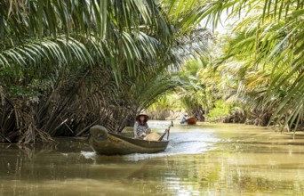 Vietnamese Woman ina rowing boat, Mekong Delta, Vietnam, Asia