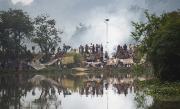 Villagers participate in a community fishing event on the occasion of the Bhogali Bihu festival at