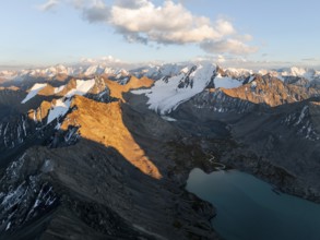 Evening mood, mountain panorama, aerial view, 4000 metre peak with glacier, mountain pass and